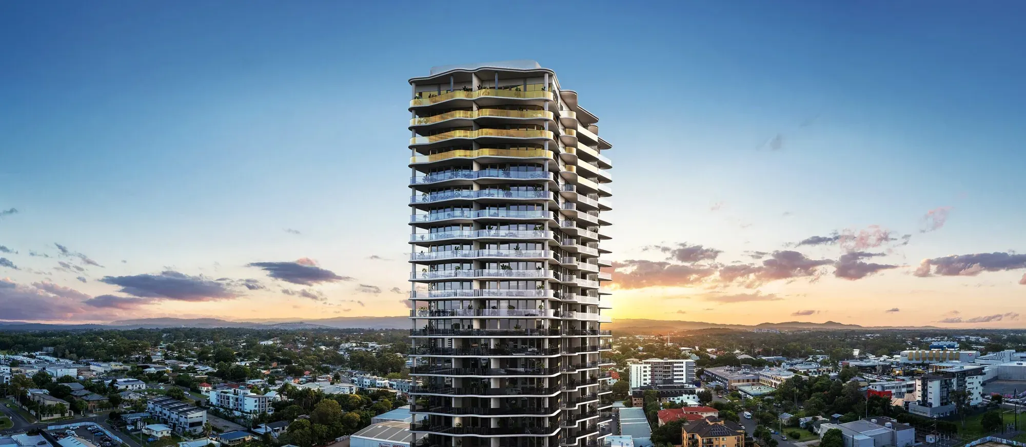 Render of the Monarch Place tower at dusk, its curved gold and glass balconies rising above the Gold Coast hinterland skyline